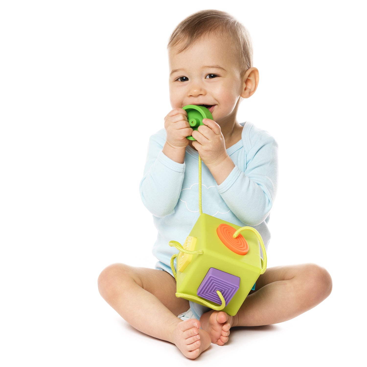 little-boy-in-romper-sitting-and-playing-with-plas-2024-10-16-19-16-22-utc.jpg